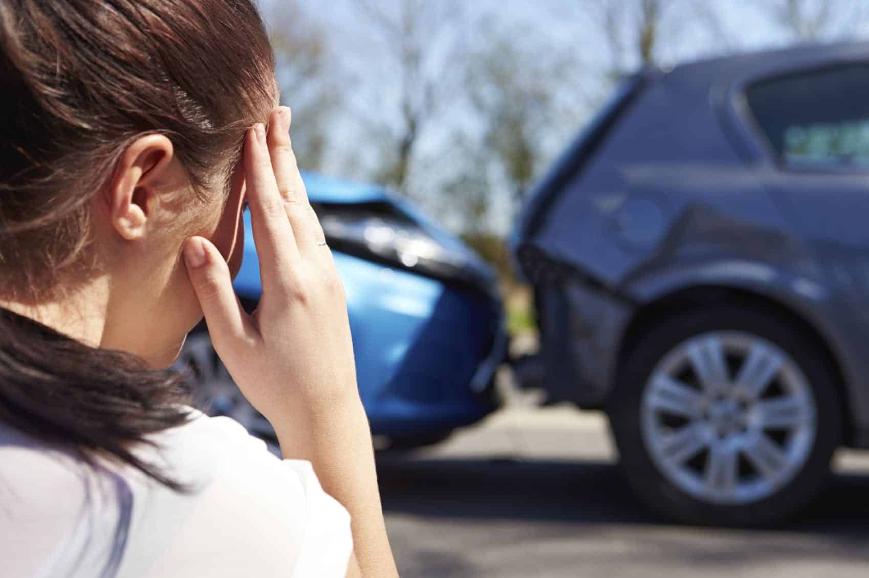 Young Woman In Distress After Car Accident Stock Photo