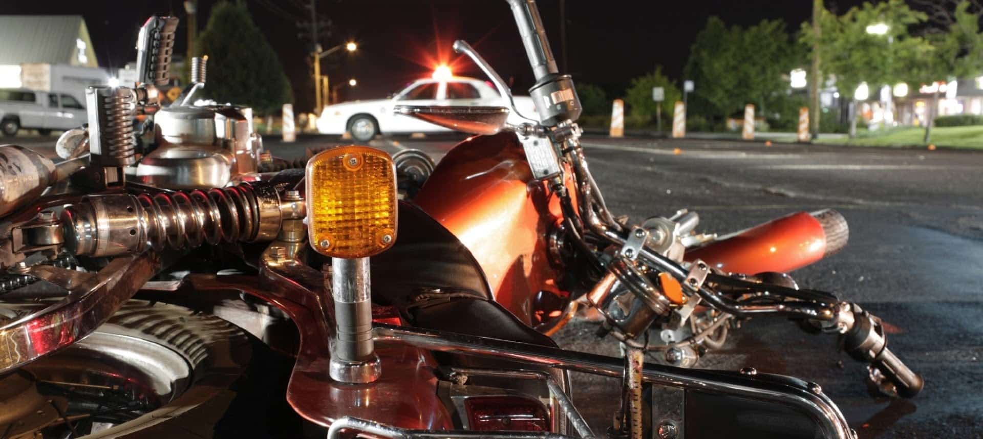 Motorcycle Accident On A City Street At Night Stock Photo