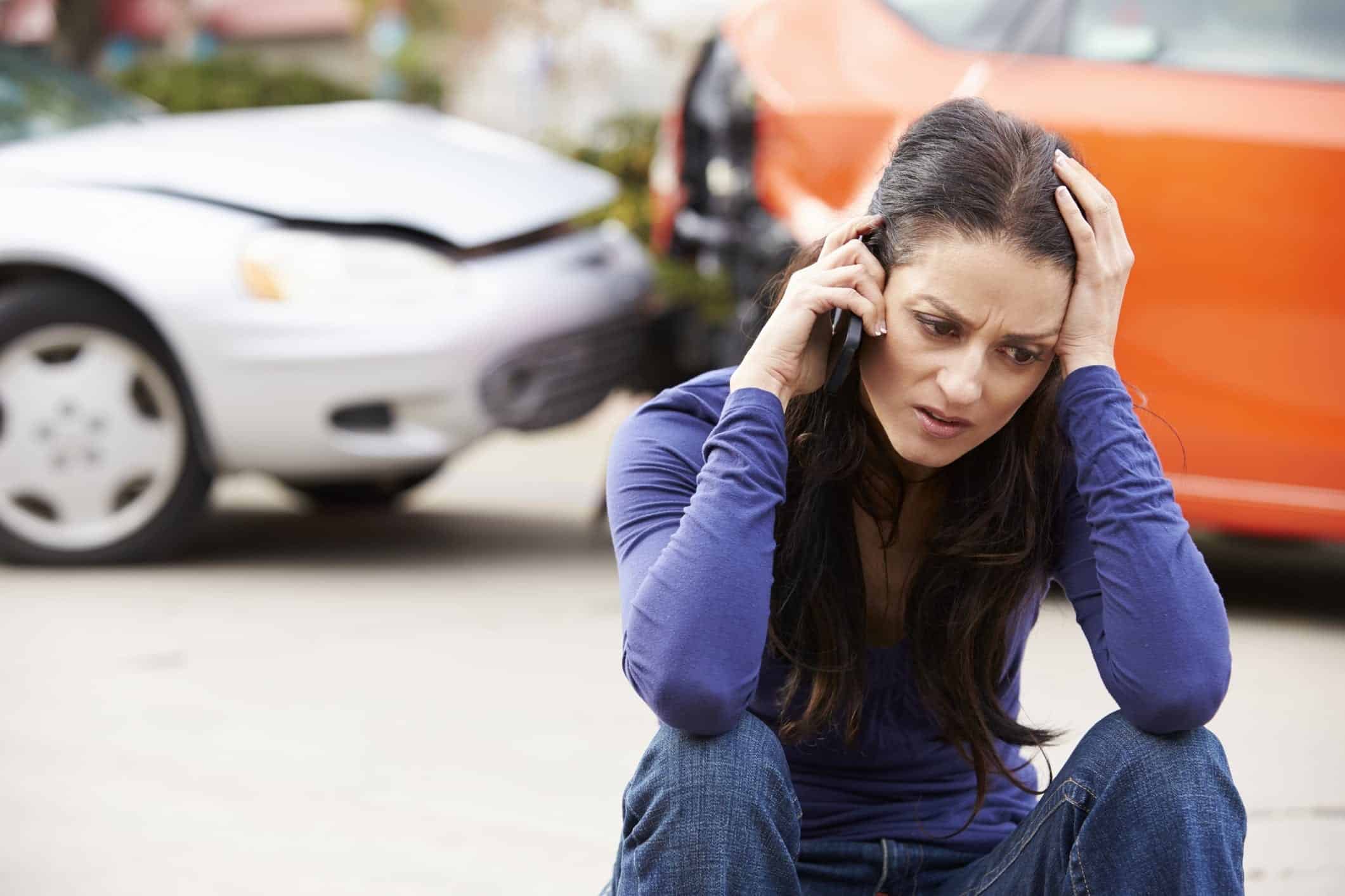 Female Driver Making Phone Call After Car Accident Stock Photo