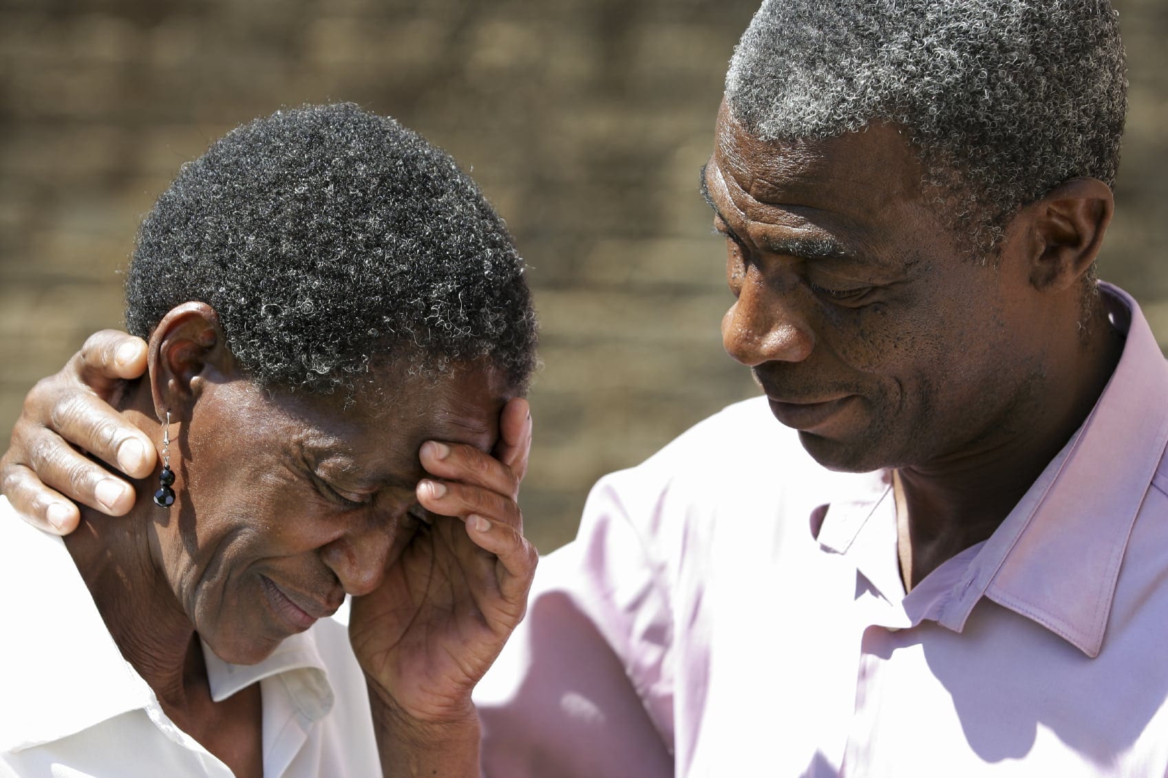 Mature Husband Consoling His Grieving Wife Stock Photo