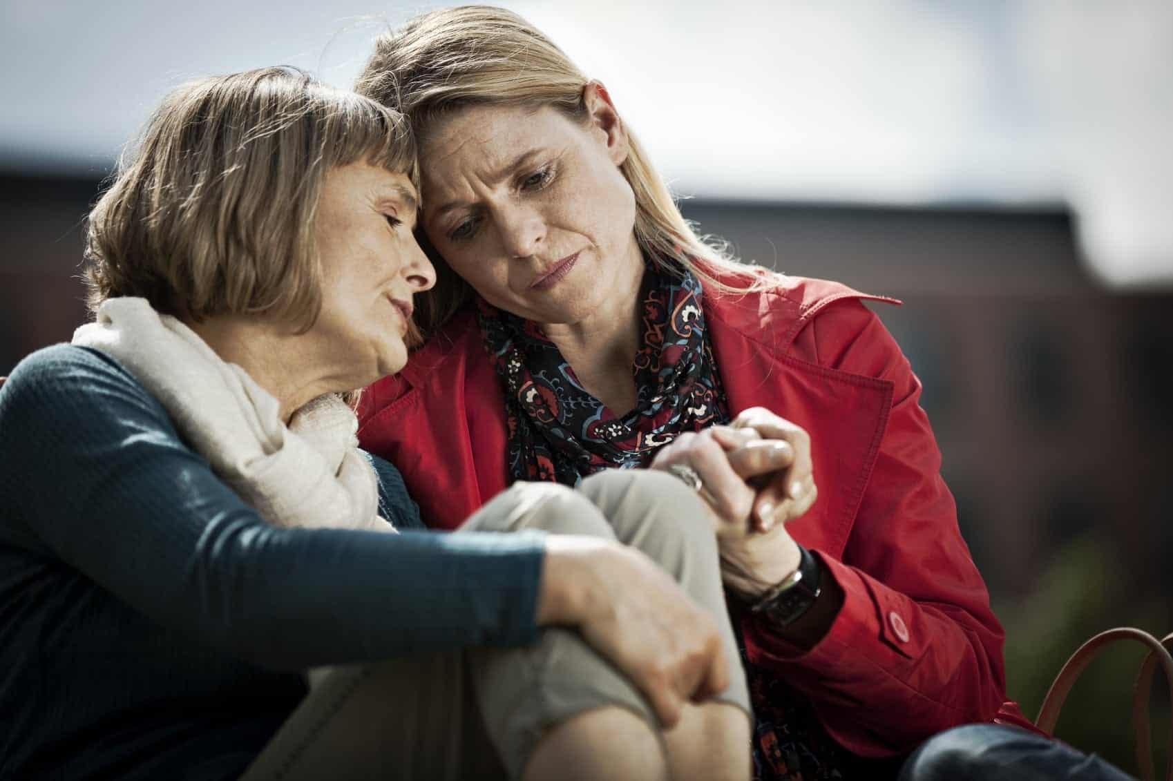 Middle-aged Woman Consoling Each Other Stock Photo
