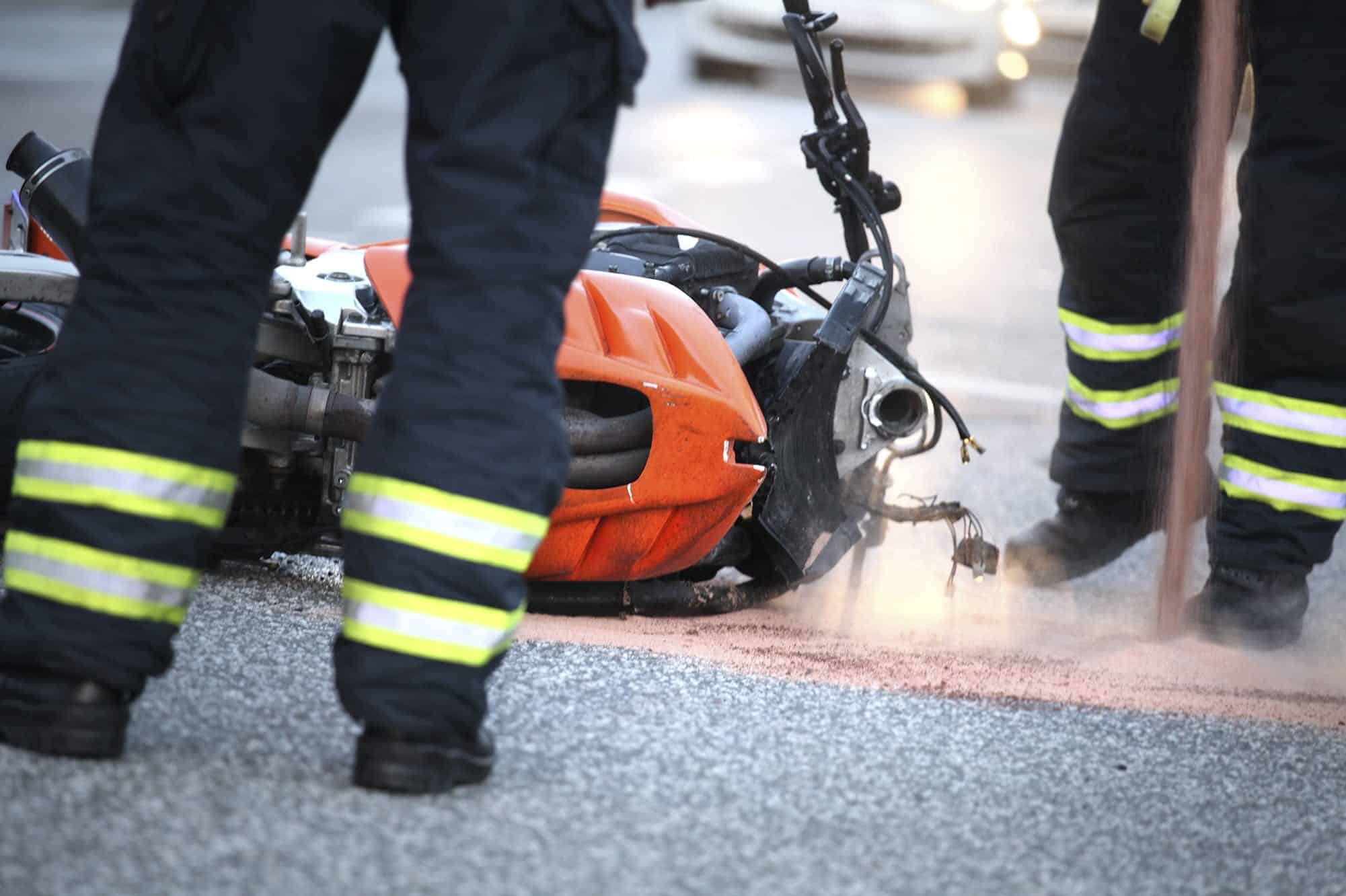 Firefighters Responding To Motorcycle Accident Stock Photo