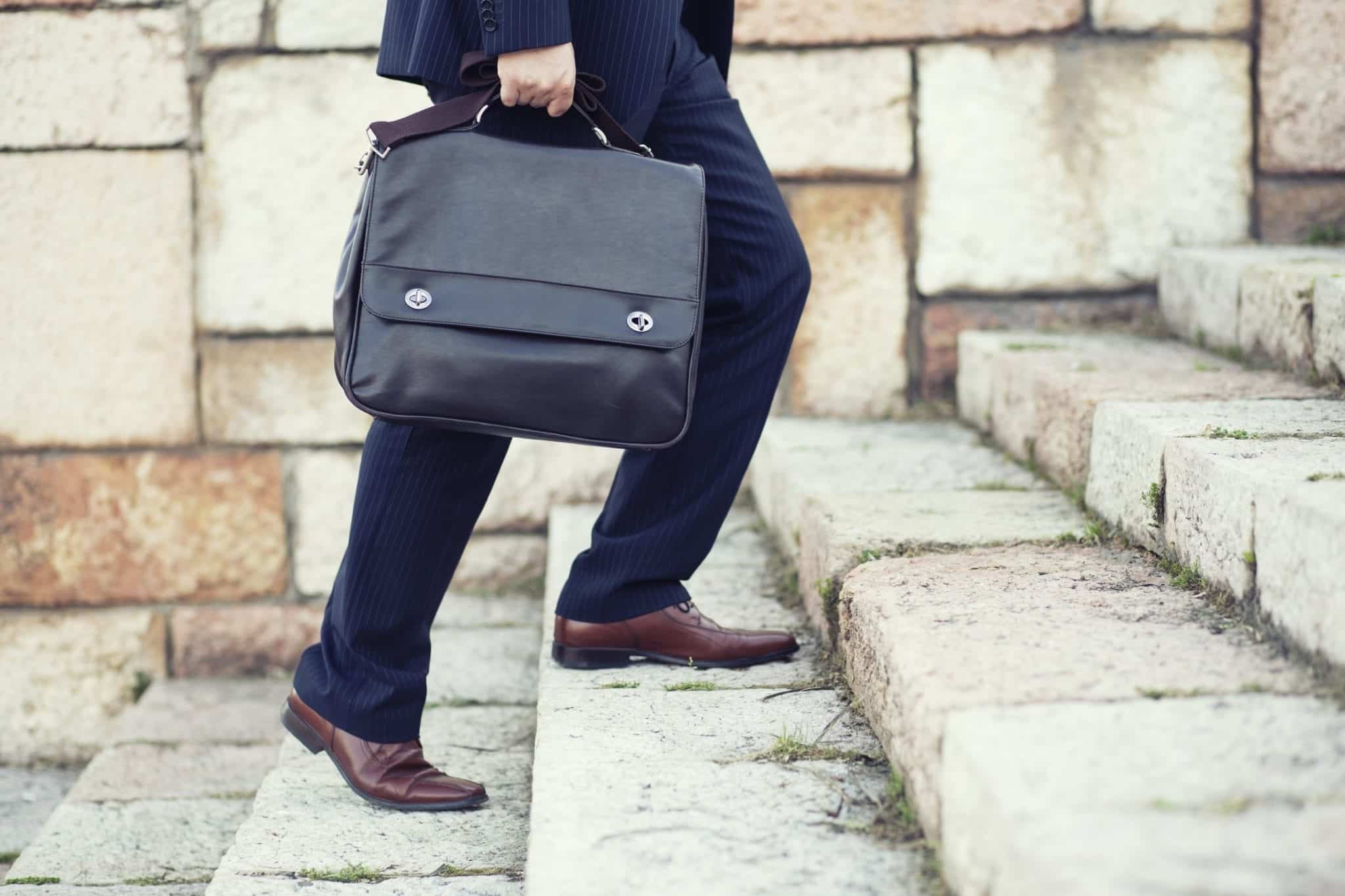 Lawyer In Suit Carrying Legal Briefcase Stock Photo