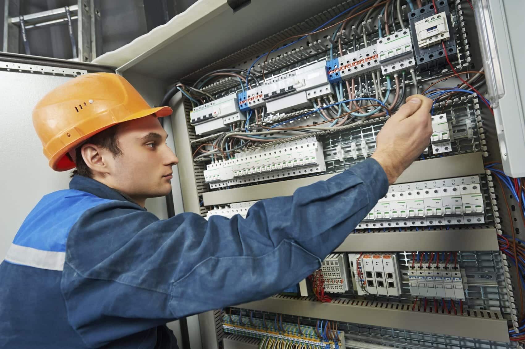 Electrician Working With Wiring Stock Photo