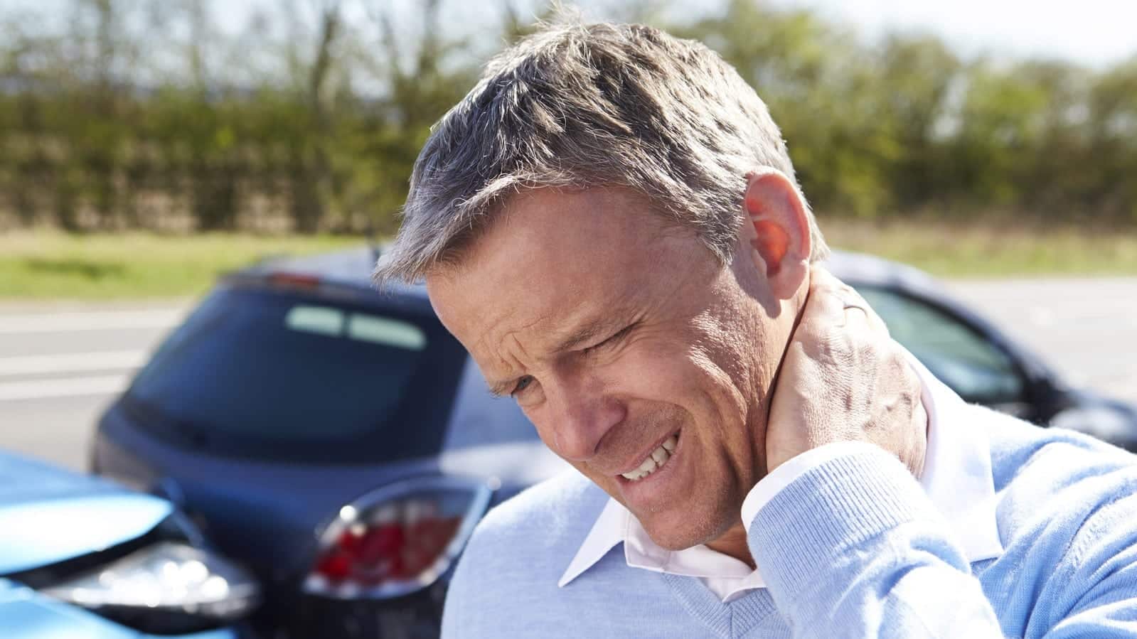 Man With Neck Pain After Rear End Car Accident Stock Photo