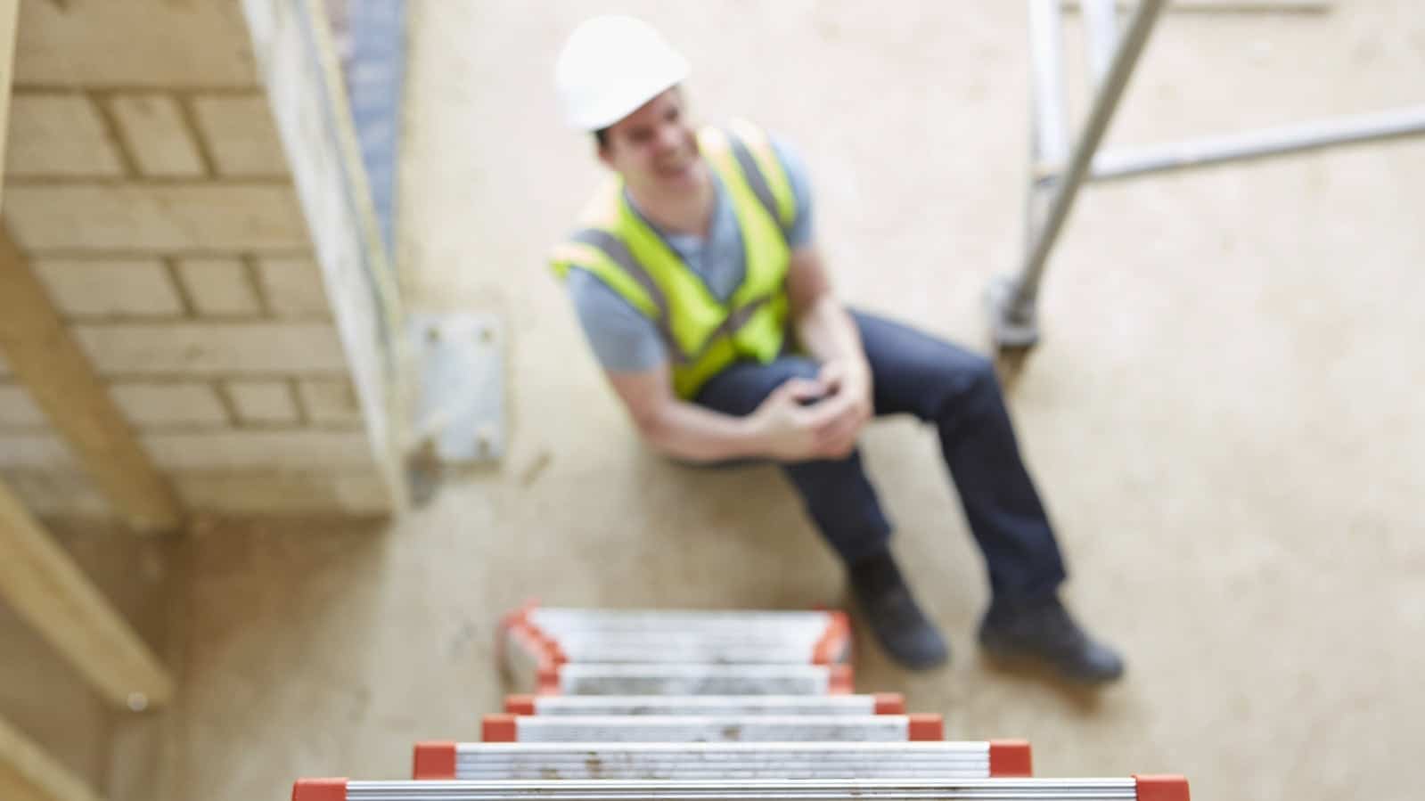 Construction Worker With Knee Injury Stock Photo