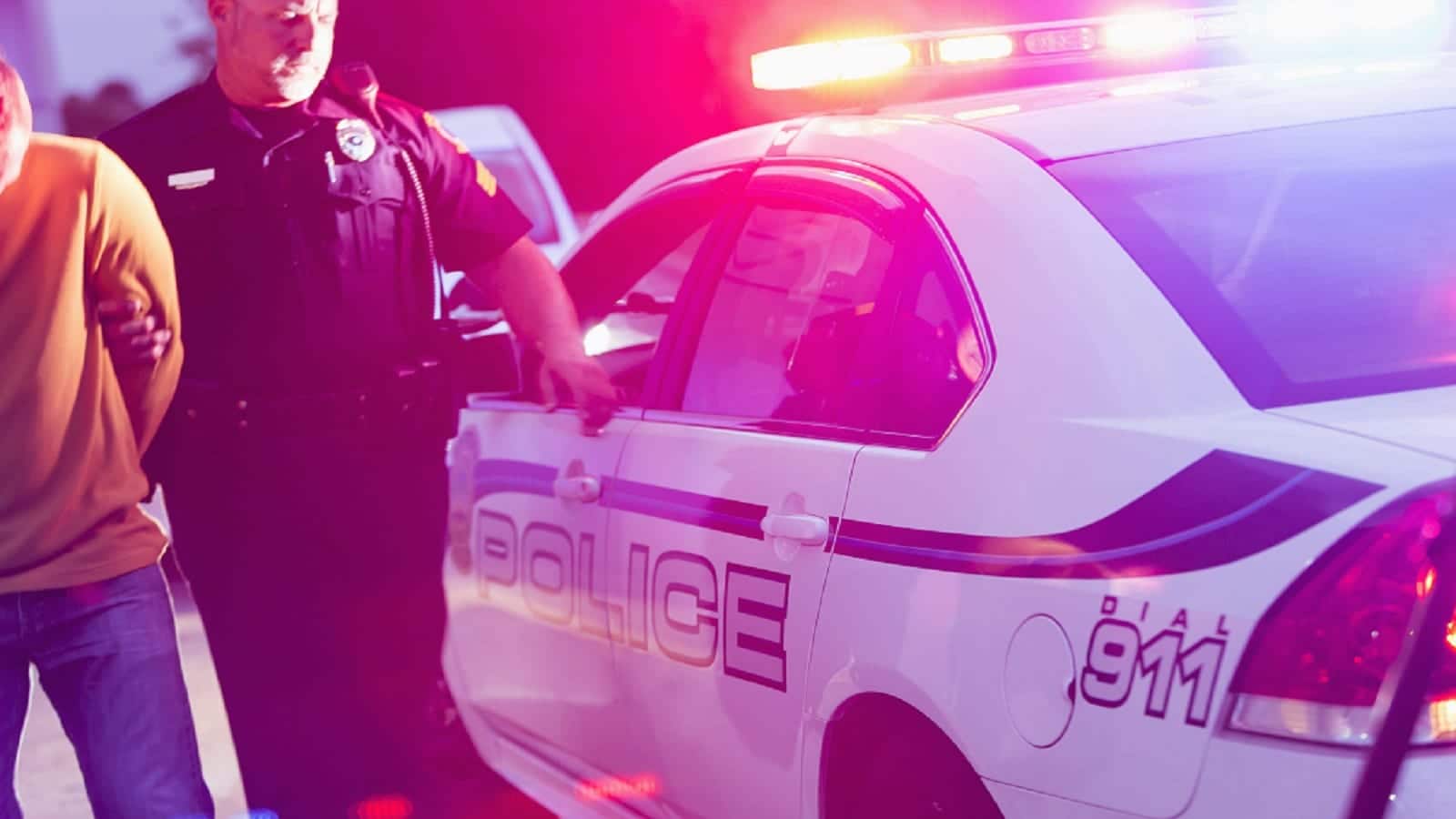 Police Officer Arresting A Drunk Driver Stock Photo