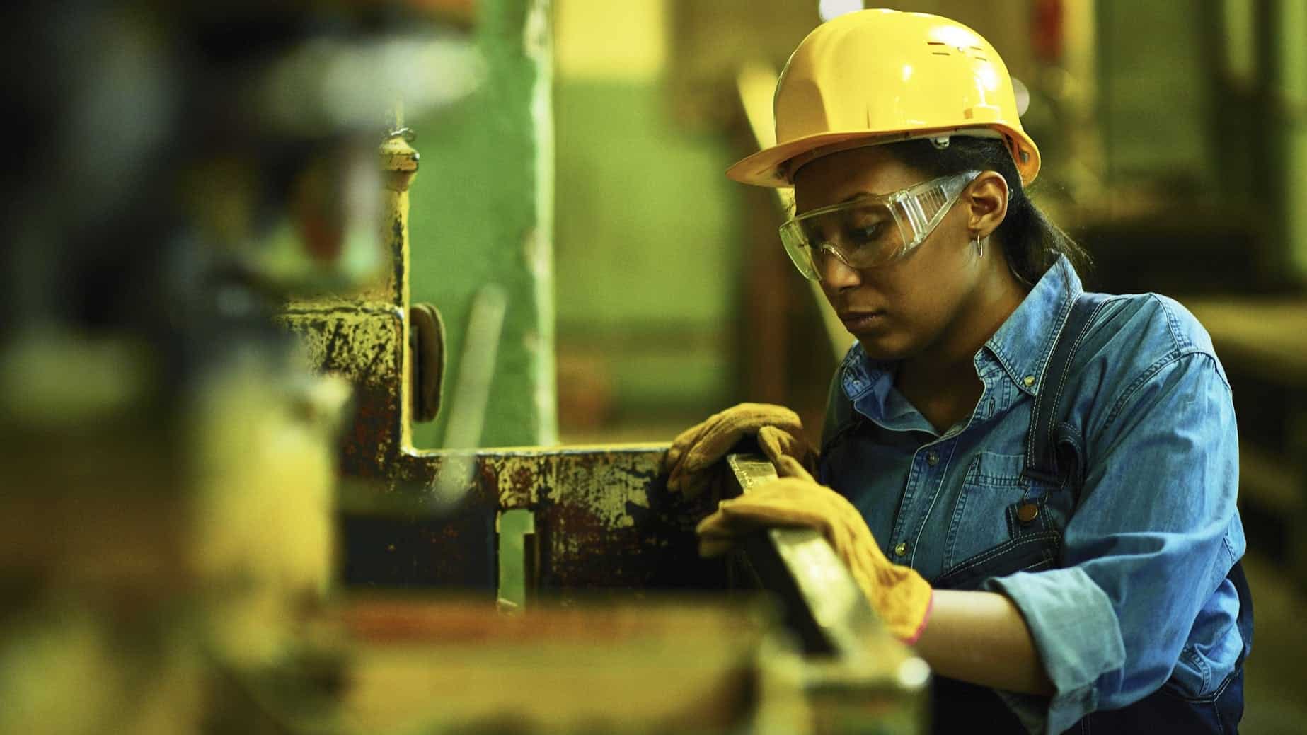 Female Worker In A Hard Hat Stock Photo