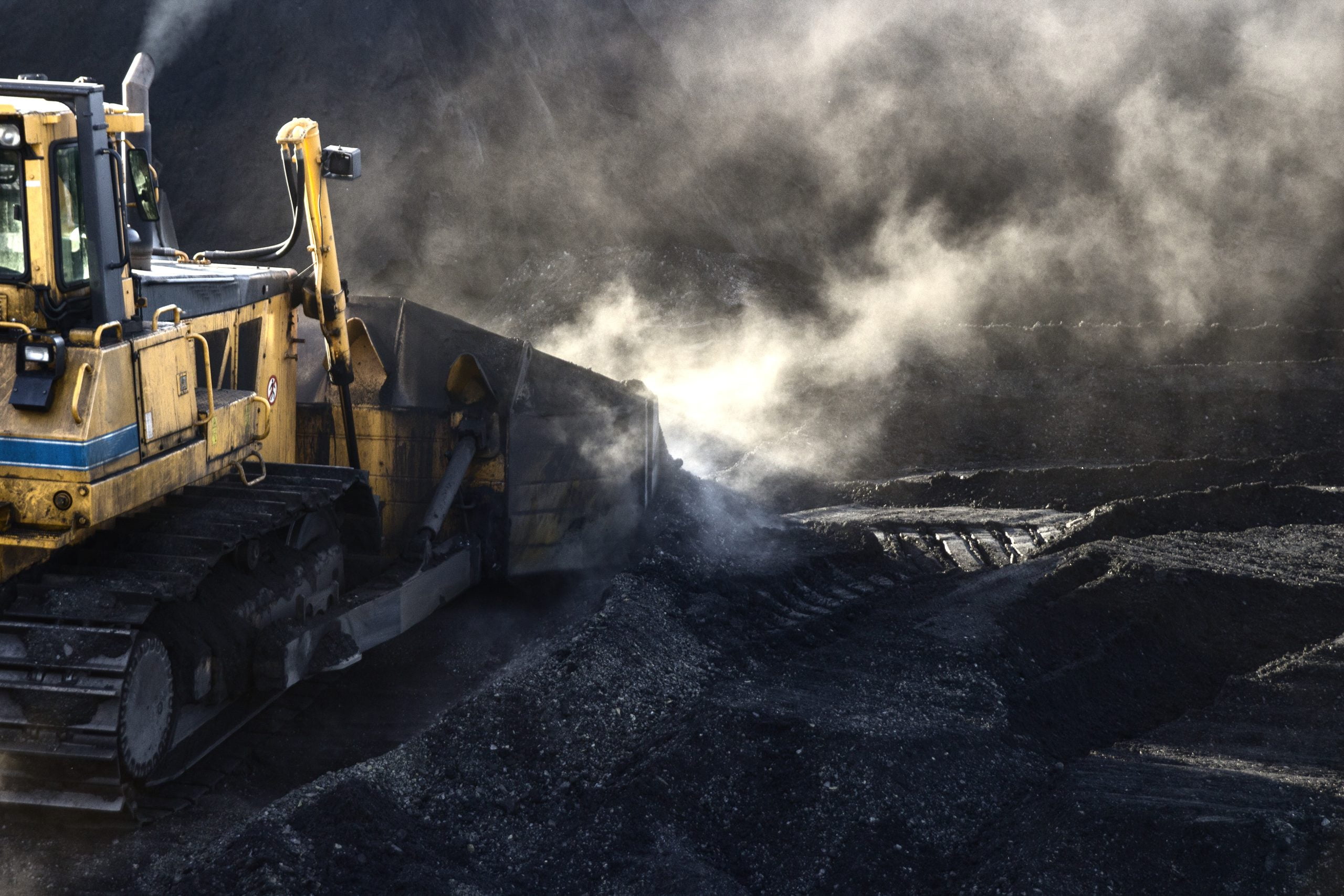 bulldozer pushing coal