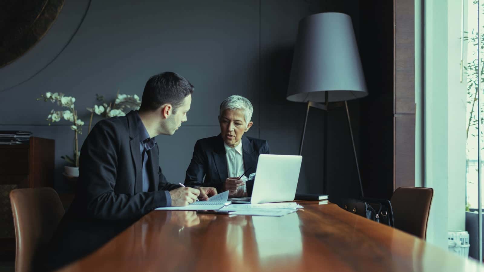 Two Personal Injury Lawyers Meeting Privately Stock Photo
