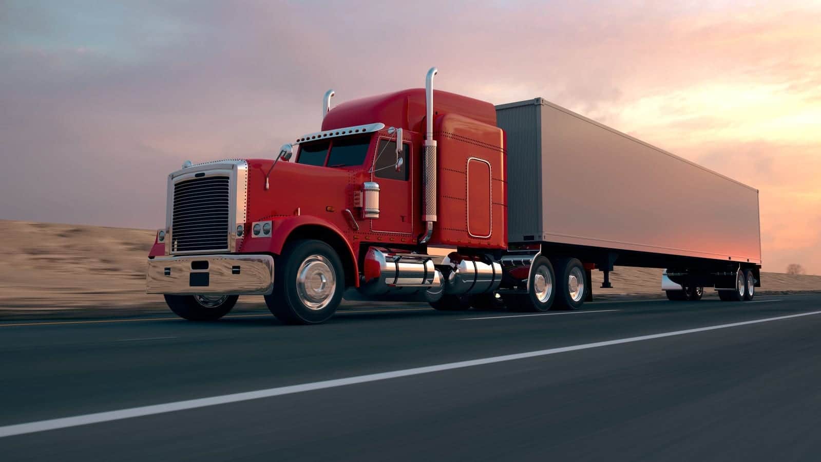 Red 18-wheeler Truck Driving On The Interstate Stock Photo